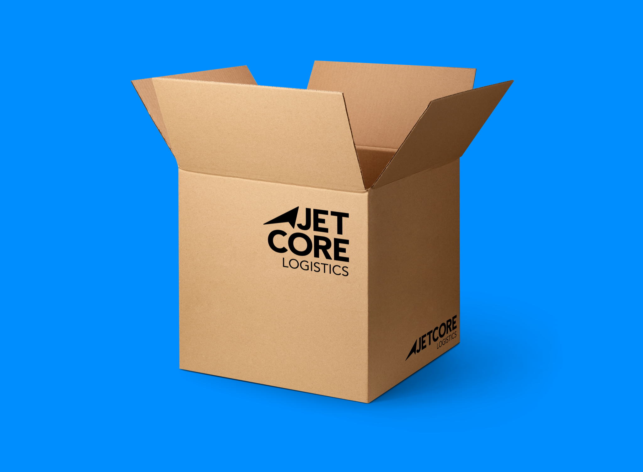 Concept application mockup: an open kraft cardboard box on a blue background printed with the stacked Jetcore Logistics lockup in black.